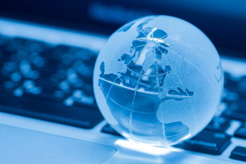 //globallinkrecruitment.com/wp-content/uploads/2025/02/business-concept-glass-world-laptop_2.jpg