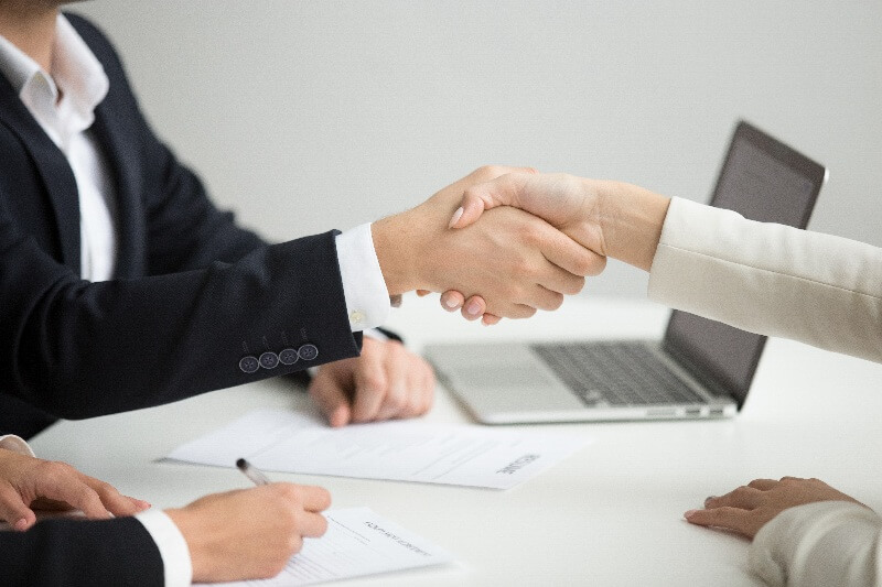 //globallinkrecruitment.com/wp-content/uploads/2025/02/hr-handshaking-successful-candidate-getting-hired-new-job-closeup-2.jpg